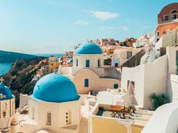 Vol en hélicoptère au coucher du soleil au-dessus de Santorin depuis Fira