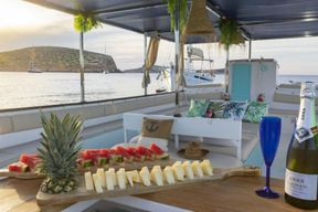 Sunset boat tour with tapas, open bar and water sports in Ibiza